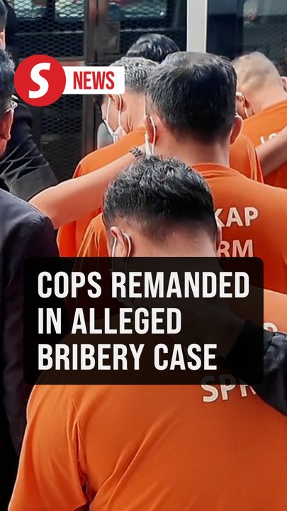 Four cops remanded five days over alleged graft involving couple in car