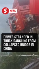 Truck teeters on collapsed bridge as driver awaits rescue in China