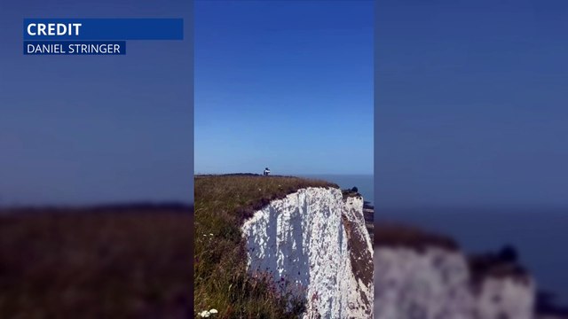 Jaw-dropping footage shows the moment a daredevil jumped off the White Cliffs of Dover