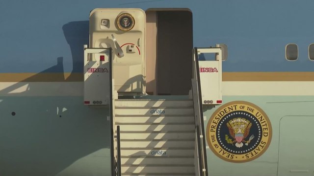 TRUMP'S CRAZY GESTURE as he exits Air Force One after landing in Europe due to high winds