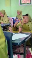 Child Counts Fingers and Toes in Math Class