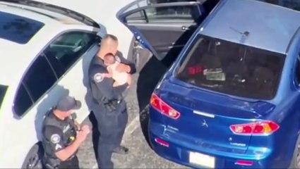 Watch: Police smash window to rescue baby locked in 110-degree car