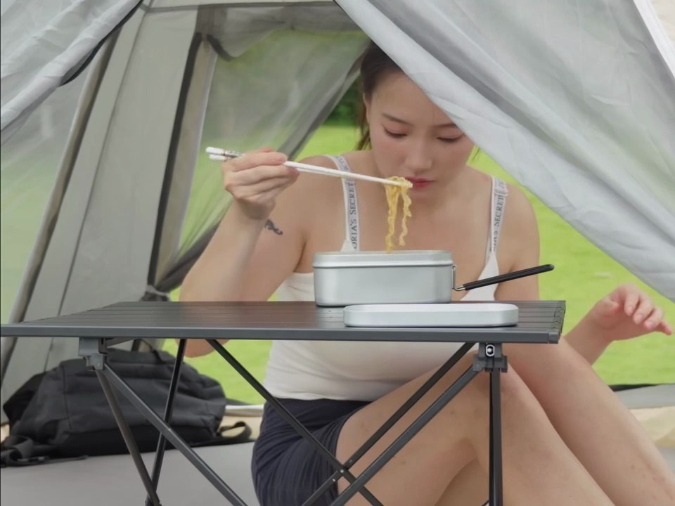 Solo girl camping alone relaxing in nature and cooking alone