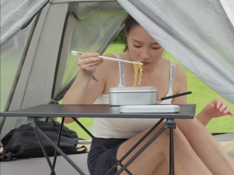 Solo girl camping alone relaxing in nature and cooking alone