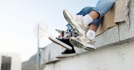 Shoes, legs and couple on rooftop in the city