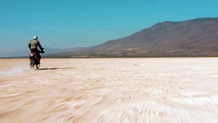 mixkit-tacking-view-of-a-motorcyclist-in-the-desert-43101-hd-ready