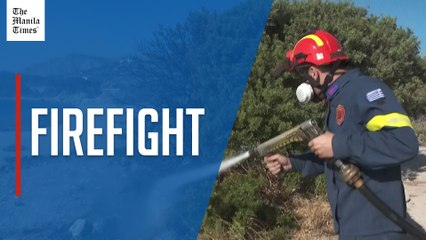 Greece battles wildfire in coastal town near capital