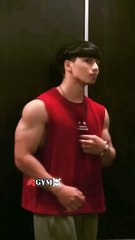 A bodybuilder striking a pose that showcases their biceps and chest.