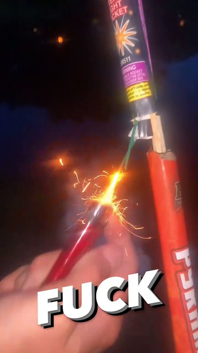 Guy lights bottle rocket fireworks while attached to a stick and burns hair on his arm