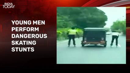 Video: Young men perform skating stunts by holding onto moving auto-rickshaw