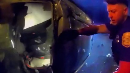 Florida police smash through glass to rescue woman from car inferno