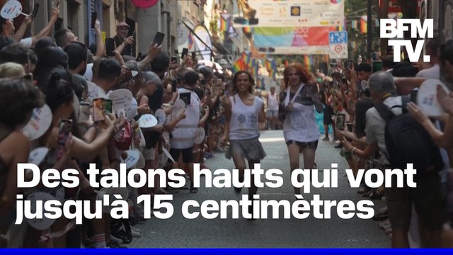 Des coureurs participent à une course en talons hauts pendant la semaine des fiertés à Madrid