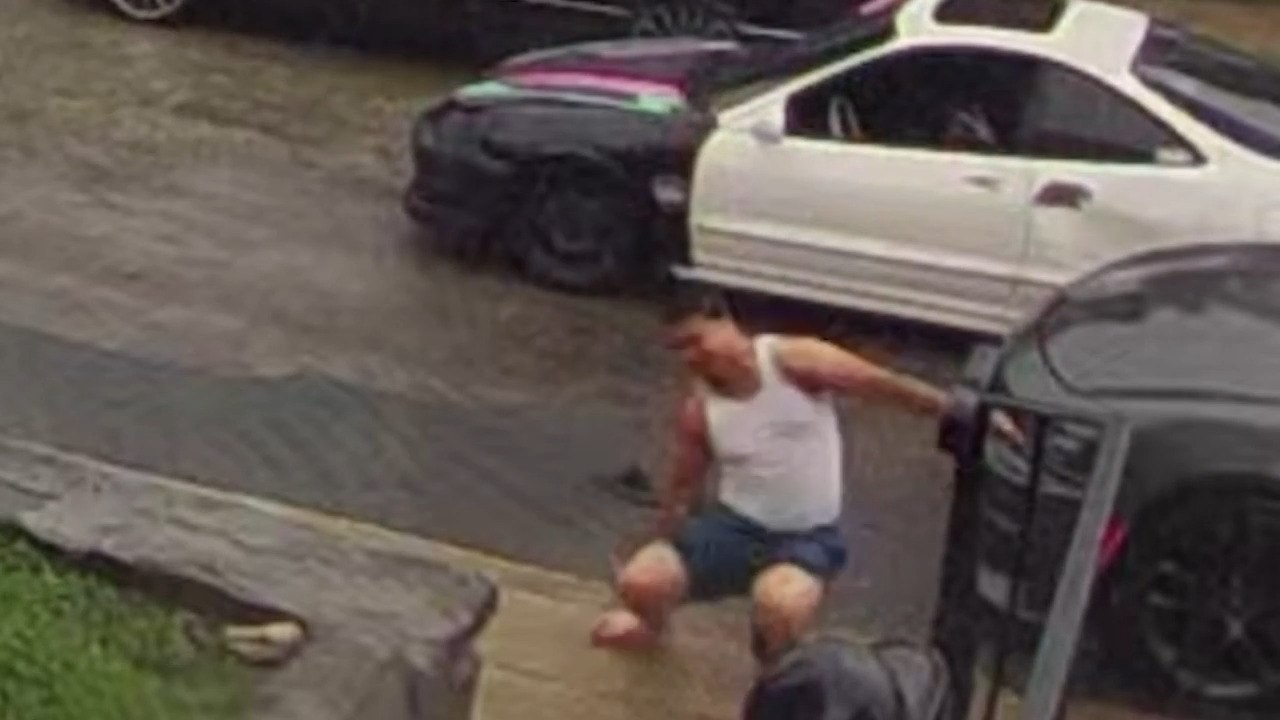 Man Nearly Falls and Loses Slippers Trying to Jump Over Puddle