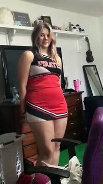 Cadence tries on her 6th grade cheerleading uniform