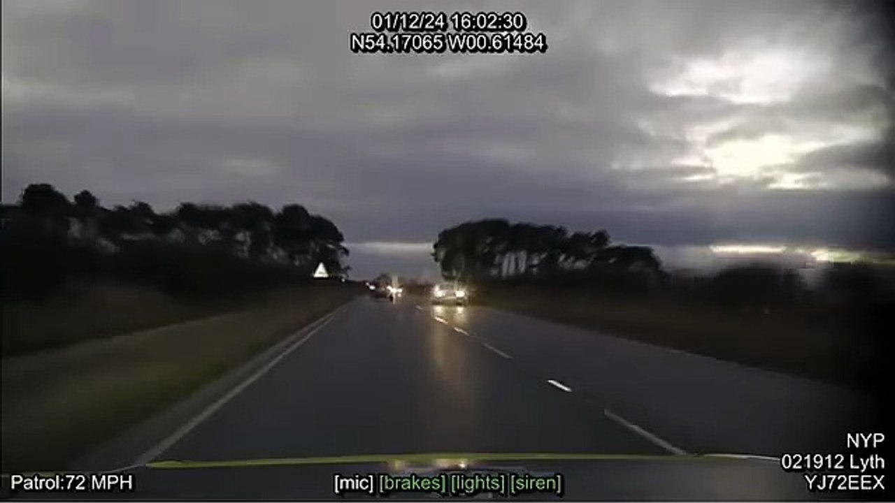 Police footage shows the moment a driver's actions almost cause head-on crash