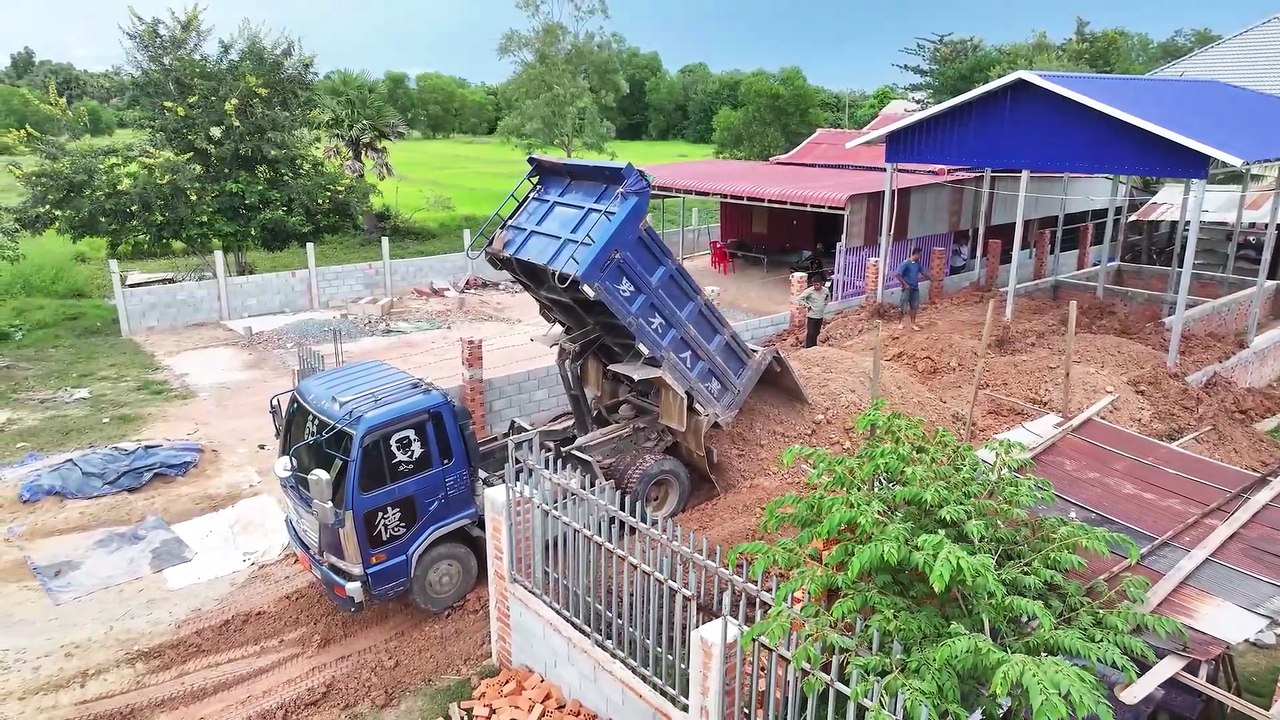 A small project was completed in one day using a Komatsu D21A Dozer to push soil to fill a house.