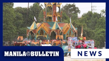 Decorated boats sail in a fluvial parade for the 2025 Pagoda Festival in Bocaue
