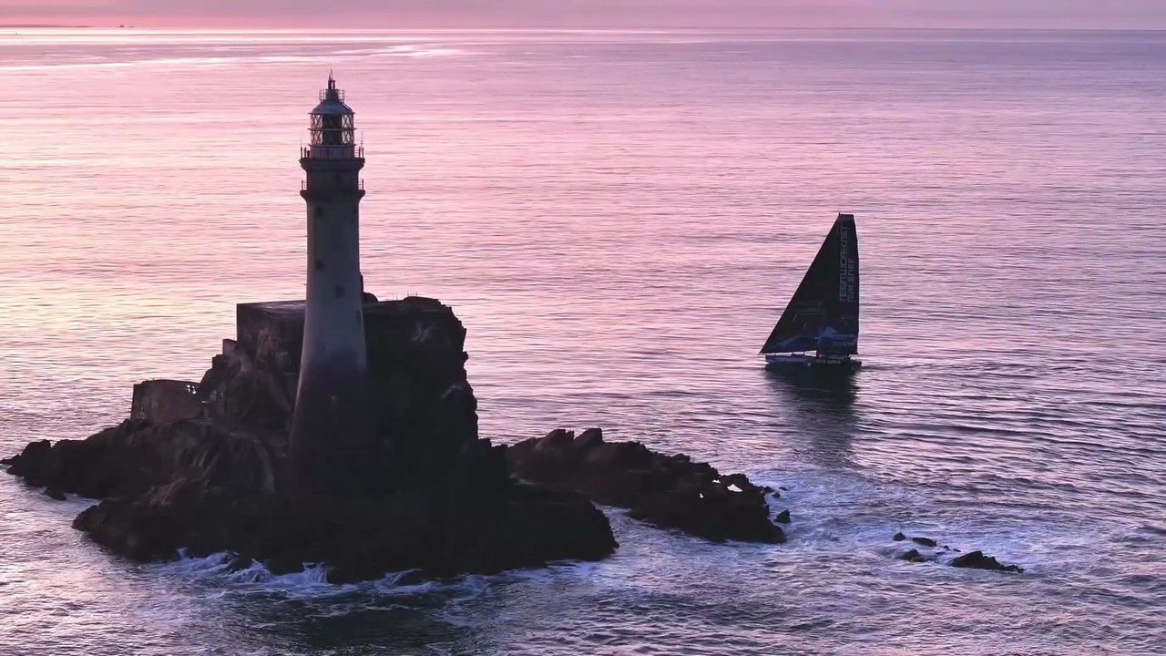 IMOCA Globe Serie 2025 : Epic sunrise drone shot of TeamWork-Team SNEF at the iconic Fastnet Rock I Course des Caps 2025