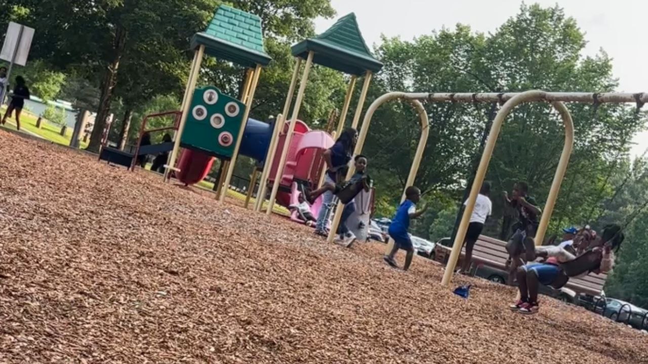 Two kids fall back-to-back while playing on the...