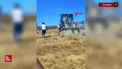 İstanbul'da bir tarlada çıkan yangına, vatandaşlar hortumla müdahale etti