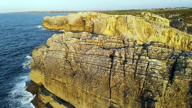 Aerial View Of Sea Waves Breaking On Rocky Shore At Sunset 1
