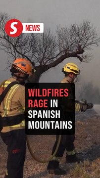 Spanish firefighters battle wildfires in Catalonia mountains