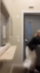 Woman Struggles to Close Door in Massachusetts During Storm