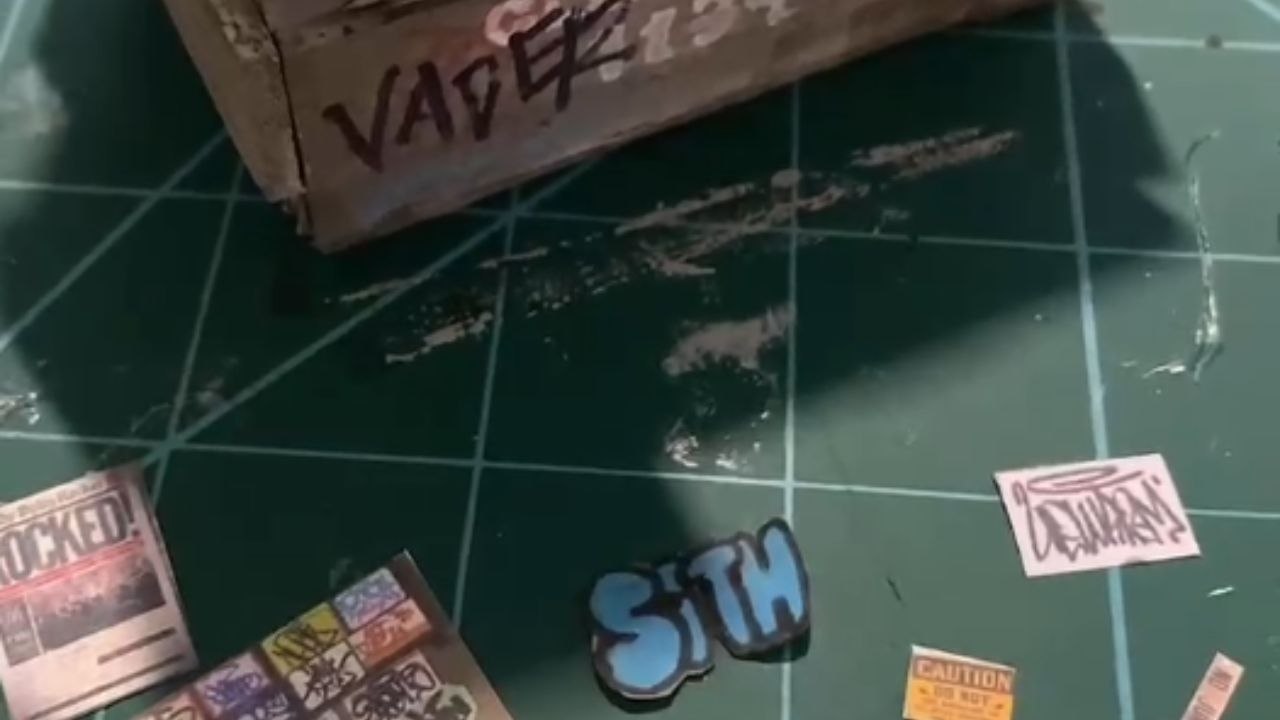 Artist shows how to make a miniature dumpster using craft materials