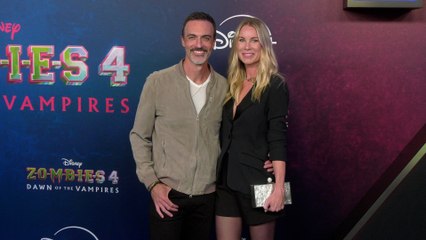 Reid Scott and Elspeth Keller "Zombies 4: Dawn of the Vampires" Premiere Blue Carpet