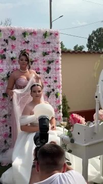 Bride Falls as Veil is Being Attached