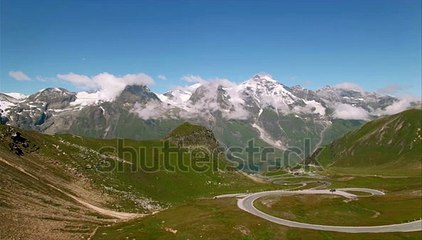 stock-footage-aerial-view-of-cars-and-tourist-busses-climbing-up-the-grossglockner-alpine-road-in-austria-with (1)