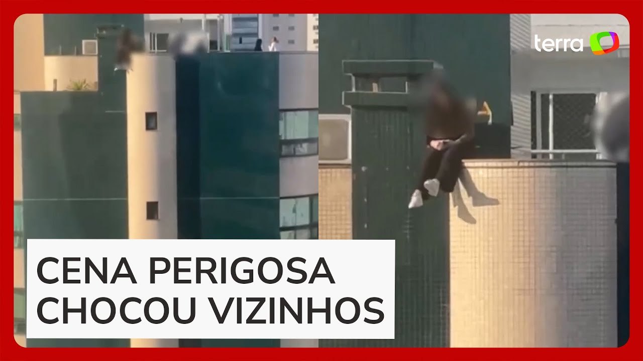 Jovem se arrisca e senta em parapeito de prédio de 9 andares em Balneário Camboriú