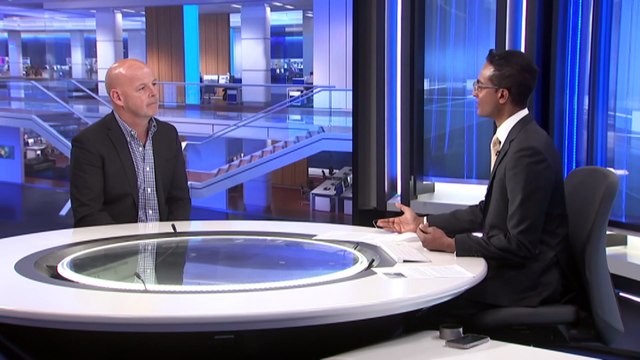 Nurse Keith Donnelly opens communal wardrobe for hospital mental health patients