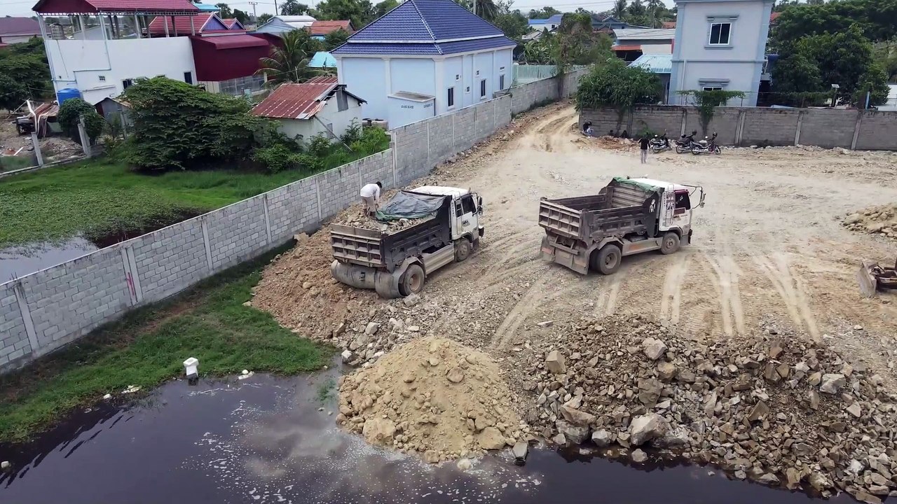 The Pretty Skill Working Develop Landfill to Lake By Dozer D20P Pushing Stone Soil with Truck Unload