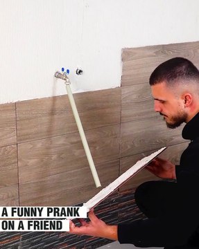 A hilarious video of two friends laying tiles together!
