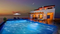 Luxurious villa at dusk next to the sea