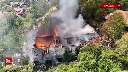 Karabük'ta otluk alanda sıçrayan yangın iki katlı evi kül etti