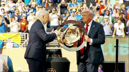 Trump puzzles Chelsea players as he crashes Club World Cup trophy party