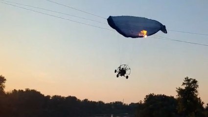 Moment paraglider flies into power lines in North Dakota
