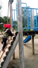 Kid is climbing a ladder