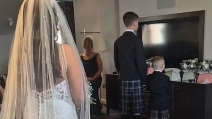 Boy sees his mom in wedding dress and breaks down in tears
