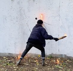 A Dance of Flames: Watch Him Craft Stunning Art with Fire!