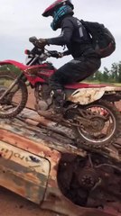 Enduro Rider Falls Hard Trying to Ride Over Burnt-Out Car