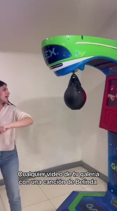 Girl Gets Hit by Boxing Bag While Using Punching Machine