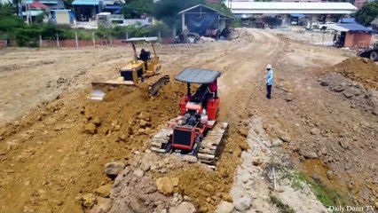 best equipment mini dozers pushing soil and truck unloading soil