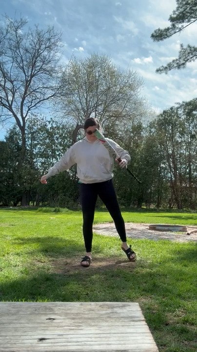 Woman Keeps Hitting Herself While Trying Baseball Bat Trick