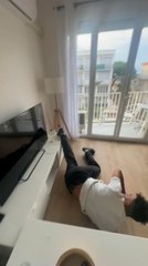 Guy Accidentally Damages TV Cabinet While Attempting Backflip Indoors