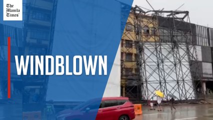 2 vehicles damaged as billboard falls in Quezon City