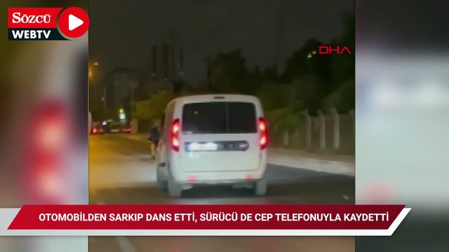 Otomobilden sarkıp dans etti, sürücü de cep telefonuyla kaydetti