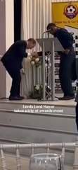 Lord Mayor has a 'Naomi Campbell' moment as he falls onto stage in hilarious video